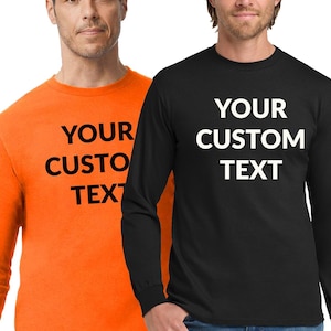 May include: Two long-sleeved shirts, one orange and one black, each with the text "YOUR CUSTOM TEXT" in white. The shirts are plain and suitable for customization. The models are wearing blue jeans.