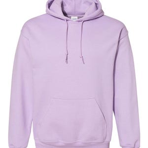 May include: A light lavender hooded sweatshirt featuring long sleeves, a front kangaroo pocket, and a matching drawstring at the neck. The garment includes a Gildan brand label at the inner collar and ribbed cuffs at the wrists and bottom hem.