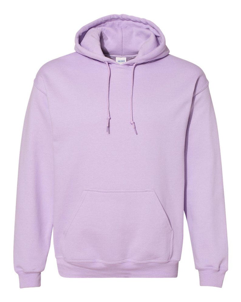 May include: A light lavender hooded sweatshirt featuring long sleeves, a front kangaroo pocket, and a matching drawstring at the neck. The garment includes a Gildan brand label at the inner collar and ribbed cuffs at the wrists and bottom hem.
