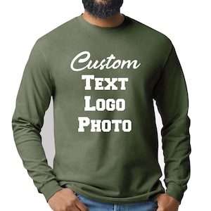 May include: An olive green long-sleeve crewneck sweatshirt featuring white text printed on the chest. The text reads Custom, TEXT, Logo, and PHOTO in a combination of script and block lettering styles. The garment has a ribbed collar and cuffs.