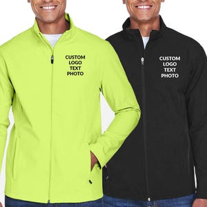 May include: Two zip-up jackets, one neon green and one black, are displayed. Each jacket has the text "CUSTOM LOGO TEXT PHOTO" printed on the chest. The jackets have a stand-up collar and side pockets.