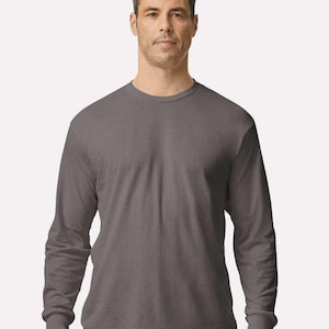 May include: A solid charcoal gray long-sleeve t-shirt with a crew neckline and ribbed cuffs. The garment features a standard fit with a straight hemline, constructed from a smooth, opaque fabric that provides full coverage for the torso and arms.