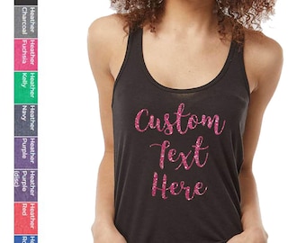 May include: A black racerback tank top featuring the words Custom Text Here in a pink glittery script font. To the left, a vertical color chart displays various available fabric options including white, black, charcoal, fuchsia, kelly, navy, and purple.