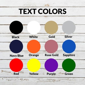 May include: A color chart titled TEXT COLORS displaying twelve circular swatches labeled Black, White, Gold, Silver, Navy Blue, Orange, Rose Gold, Sapphire, Red, Yellow, Purple, and Green, arranged in three rows of four on a white wood background.