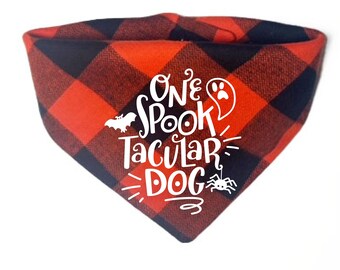 May include: Red and black plaid dog bandana with white text that says "One Spooktacular Dog" with a ghost, bat, and spider graphic.