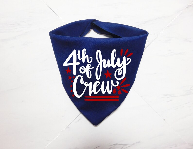May include: A blue bandana with the text "4th of July Crew" in white lettering and red stars and fireworks.