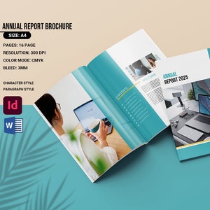 May include: An open brochure titled "Annual Report 2025" with a teal and white cover. The brochure is open to reveal interior pages with images and text. The brochure is on a teal and beige background. The brochure is A4 size.