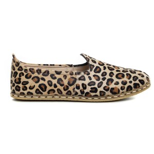 May include: Leopard print slip-on shoes with a brown leather upper and a beige sole.