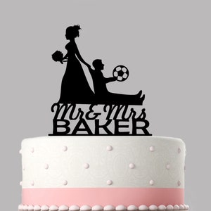 Bride dragging groom FOOTBALL funny Wedding Cake Topper Personalised acrylic cake topper,Various colours & sizes. Quality item, keepsake.850