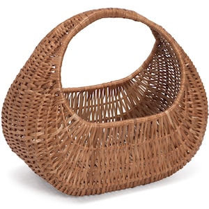 May include: A brown wicker basket with a handle. The basket is oval shaped and has a woven pattern.