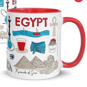 May include: White ceramic mug with a red interior and handle, featuring illustrations of Egyptian symbols and the word "EGYPT" in red. The mug has a capacity of 11 oz.