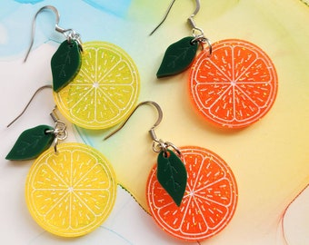 Handmade transparent orange or yellow and glitter resin fruit slice earrings and leaf, orange or lemon slice