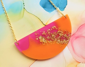 Handmade orange and pink resin bib half circle necklace with encased golden leaf