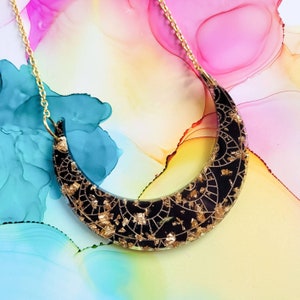 Handmade black and gold moon arc resin statement necklace on gold plated chain