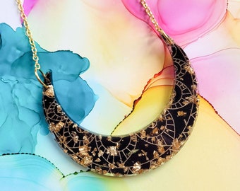 Handmade black and gold moon arc resin statement necklace on gold plated chain