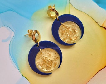 Handmade geometric navy blue resin earrings and encased golden leaf, circle shape