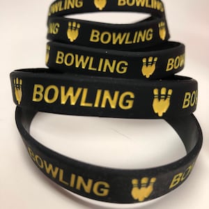 Bowling silicone wrist band/ bracelet. Fun to wear to show off your favorite sport!  You get 5 for 6.00 One size. Black & Yellow