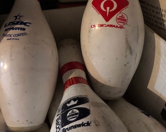 1-Regulation Bowling Pin. Used in a bowling center for several seasons of open and league kegeling! Each pin has its wear and tear.