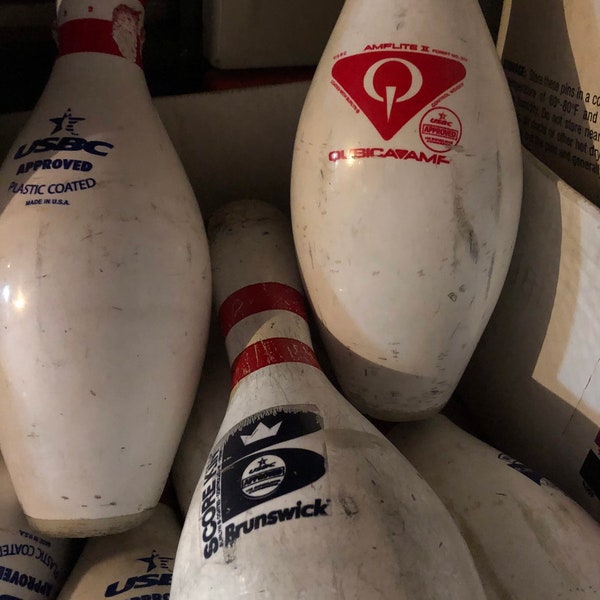 1-Regulation Bowling Pin. Used in a bowling center for several seasons of open and league kegeling! Each pin has its wear and tear.