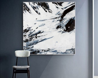 May include: Abstract painting of a snowy mountain landscape with black and white brushstrokes. The painting is framed and hanging on a wall.