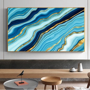 May include: Abstract wall art print featuring a blue and gold marble design. The print has a modern and contemporary style.