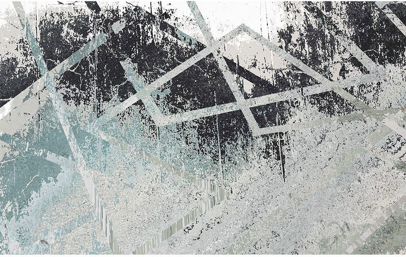 May include: Abstract art print with a distressed, textured background in shades of grey and blue. The print features a geometric pattern of overlapping lines and shapes.