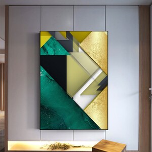 May include: Abstract geometric art print with a green, gold, and black color scheme. The print features a variety of shapes and patterns, including triangles, squares, and rectangles.