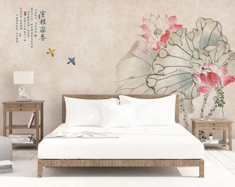 May include: A bedroom featuring a white bed with a light brown wooden headboard. The wall behind the bed displays a watercolour painting of pink lotus flowers and leaves. The wall also features text in Chinese characters. There are two small wooden bedside tables with lamps on them.