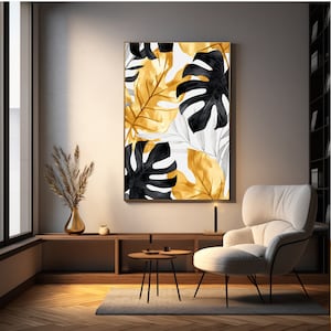 Könnte beinhalten: Ein gerahmter Druck mit einem stilisierten Design aus schwarzen und goldenen tropischen Blättern auf weißem Hintergrund.