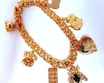 Seven Charms Link Bracelet 14kt gold 7 inch 30gm
