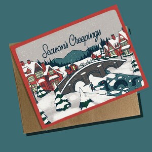 Tarjeta navideña críptica de Creepings de la temporada