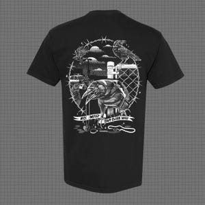 May include: Black t-shirt with a white graphic print of crows on a barbed wire fence. The graphic includes the text "No War But Class War".