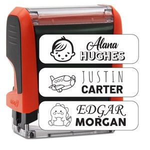 May include: Red self-inking stamp with three labels. The top label has a baby icon and the text "Alana HUGHES". The middle label has an airplane icon and the text "JUSTIN CARTER". The bottom label has a dinosaur icon and the text "EDGAR MORGAN".