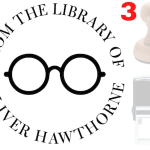 May include: A black and white round rubber stamp with the text "From the Library of Oliver Hawthorne" and a pair of glasses in the center. The stamp is labeled "3" in red.