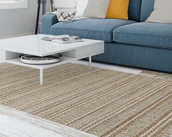 深浅不一的地毯黄麻和羊毛白色。波西米亚风格的地毯。放荡不羁的破布毯。面积地毯。手织地毯。装饰高质量的地毯。
