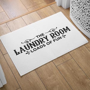 May include: White doormat with black text that reads "The Laundry Room - Loads of Fun".
