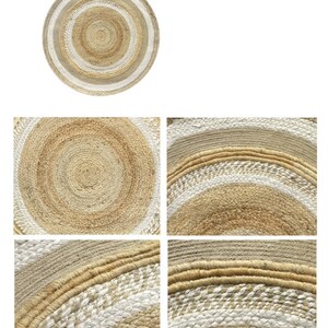 May include: A round jute rug with a white and natural color striped pattern. The rug has a woven texture and is made of natural fibers.
