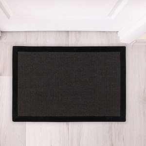 May include: Black doormat with a textured surface and a black border.