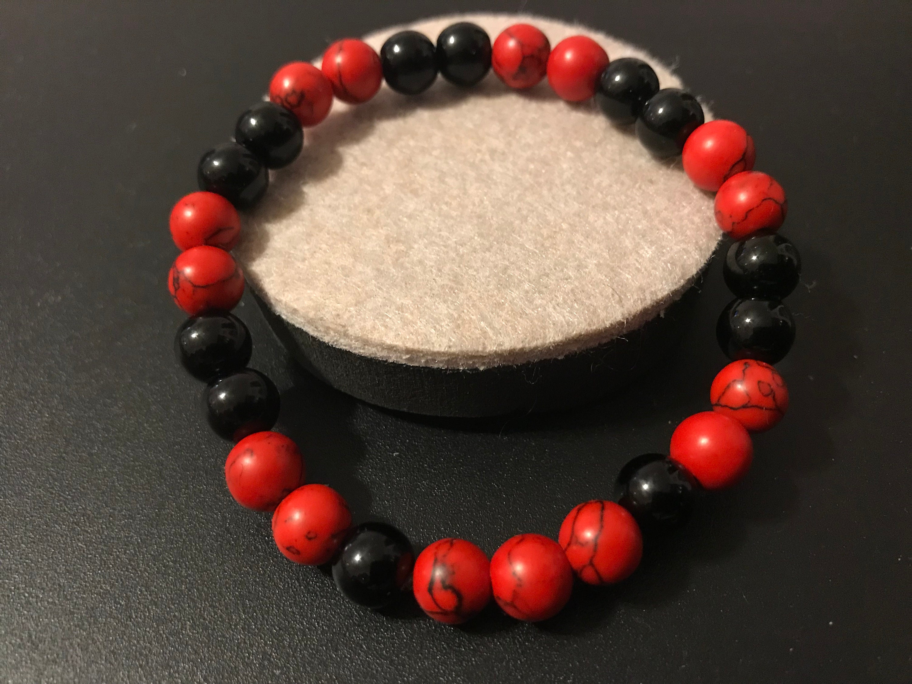 Red and black beaded best sale bracelet