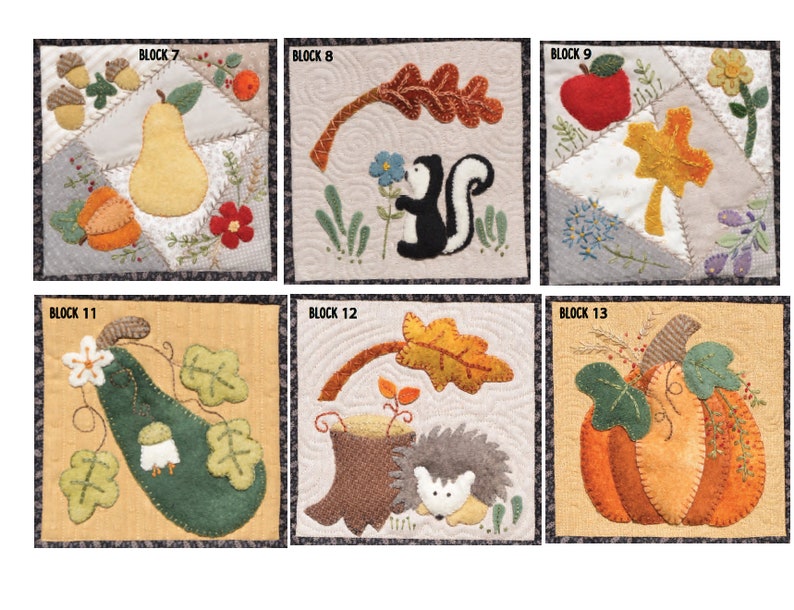 May include: A collection of six quilted fabric blocks with autumn-themed designs. Each block features appliqued elements like pears, apples, leaves, pumpkins, and a skunk. The blocks are bordered with a dark fabric and have the text "BLOCK" and a number.