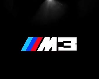 Luces de charco con proyector de logotipo LED en las puertas de BMW