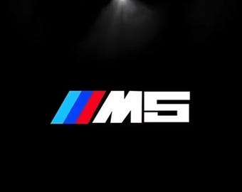 Luces de charco con proyector de logotipo LED en las puertas de BMW