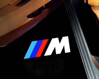Luces de charco con proyector de logotipo LED en las puertas de BMW