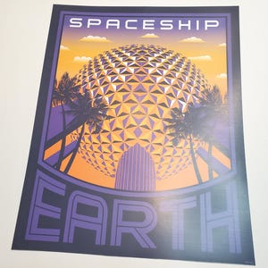 May include: A vintage-style poster with the words "Spaceship Earth" in purple. The image features a geometric sphere, palm trees, and a sunset sky in shades of orange and yellow. The poster has a dark blue border.