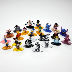 May include: A collection of 20 colorful Disney character figurines, each standing on a small base. The figurines include Mickey Mouse, Minnie Mouse, Donald Duck, Goofy, Pluto, and other popular Disney characters.