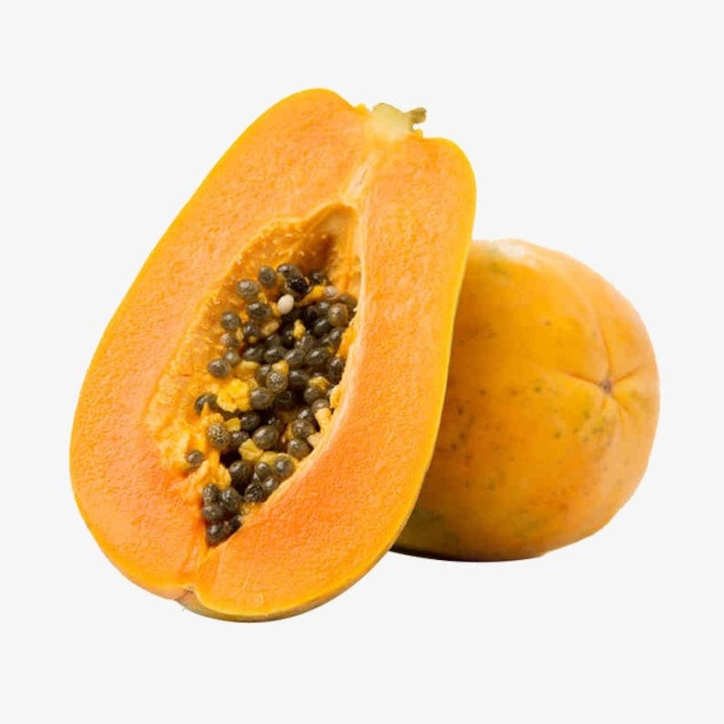 May include: A ripe papaya cut in half, revealing the orange flesh and black seeds. The other half of the papaya is whole and has a yellow-orange skin.