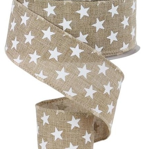 May include: A roll of 2.5 inch wide burlap ribbon with a white star pattern. The ribbon is beige and has a wired edge.