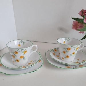 Art Deco Yellow Flower Melba Bone China Trio - Set of 2 Teacups, Saucers, Square Side Plates