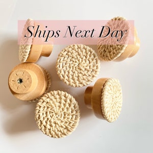May include: Six natural woven rattan knobs with a wooden base. The knobs are round and have a woven pattern.