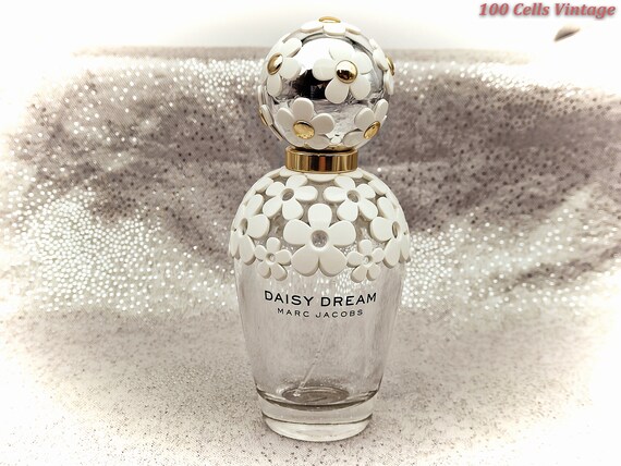 empty daisy perfume bottle